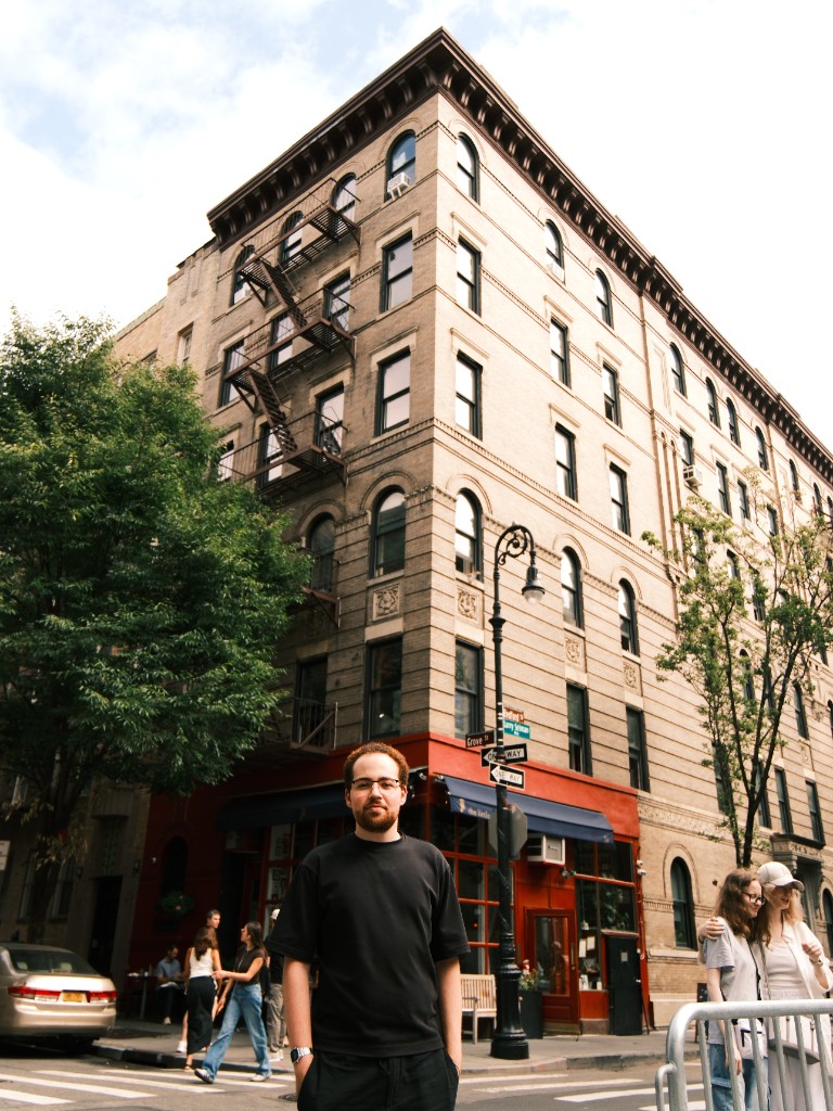 Munzer in front of the Friends apartment building on Bedford Street, New York