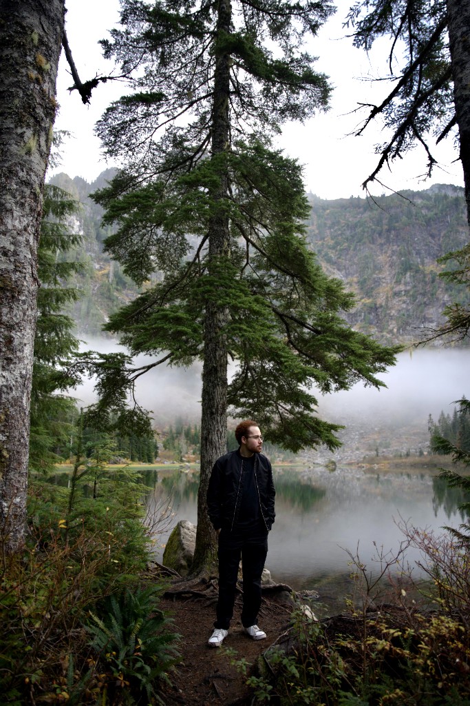 Munzer on a misty hike beside an alpine lake, Pacific Northwest